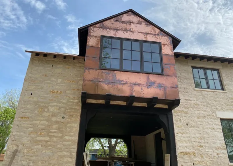 Copper metal panel facade on a stone building for Skylight Installation in Fullerton